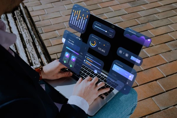 Analyzing report on ERP software dashboard insights on a laptop screen highlighting the best ERP for manufacturing businesses.